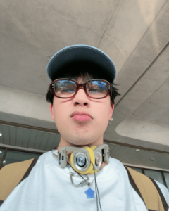 Maki Filipino singer with earphones, glasses, and star necklace