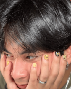 Maki Filipino singer yellow and black nails